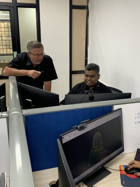 Plant Manager Larry Caron working with an engineer at Cavalier Tool India. The engineers in India are a key element of our DFM Team at Cavalier Tool and Manufacturing Limited.