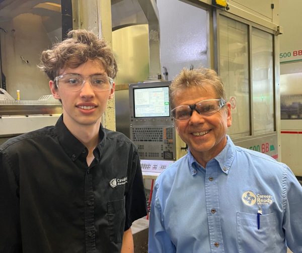Cavalier Tool Gundrill Operator Nathan poses for a picture with Richard Janik from the Career Ready Program with CTMA.