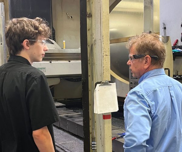 Cavalier Tool Gundrill Operator Nathan is pictured here showing Career Ready Monitor Richard Janik his Gundrill Machine at Cavalier Tool's World Headquarters in Windsor, Ontario, Canada.