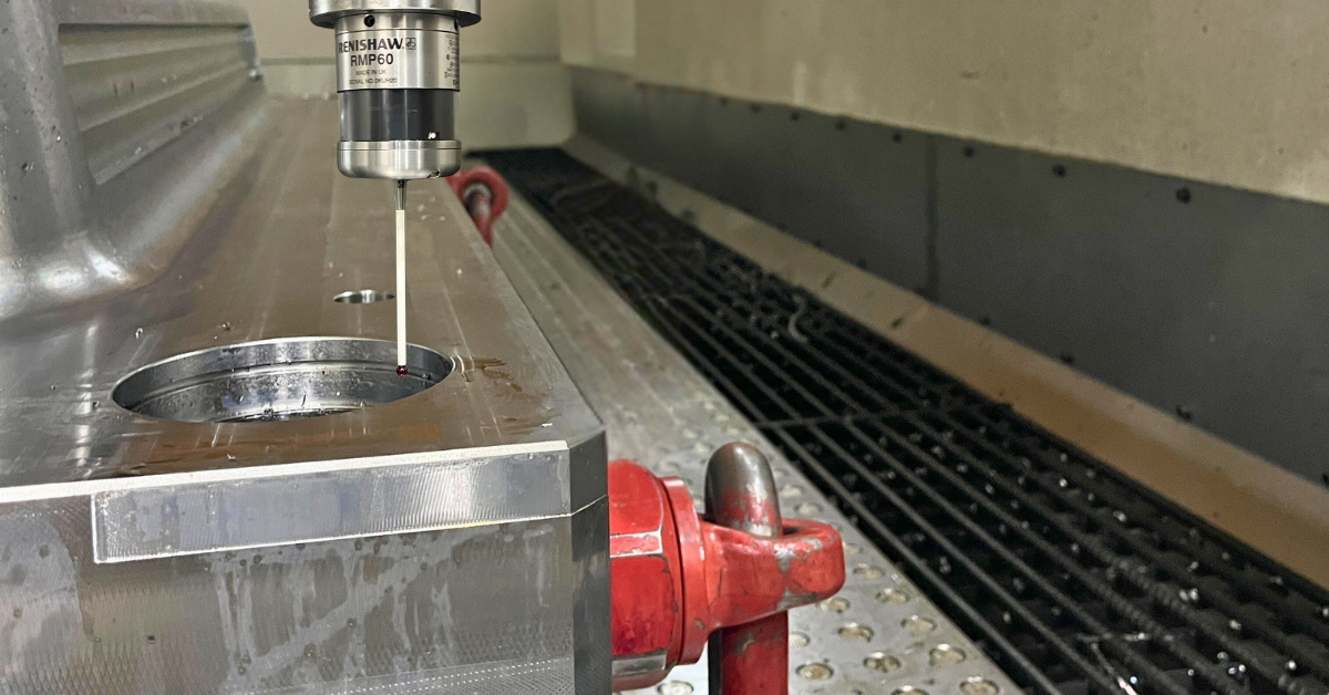 A Renishaw Probe performing setup verification on a Cavalier Tool Mold in their Huron KXG 4523